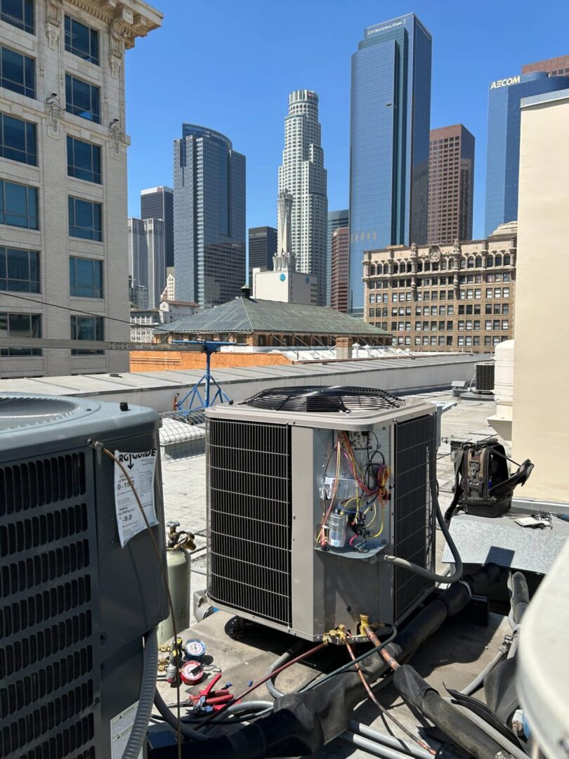 Rooftop HVAC units with city skyscrapers